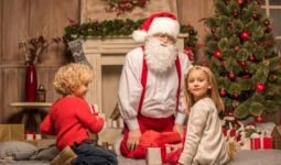 happy santa claus and children sitting on carpet w 2024 11 19 11 30 49 utc