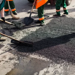 workers-on-asphalting-paver-machine-during-road-st-2026-03-17-09-01-10-utc-1