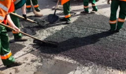 workers on asphalting paver machine during road st 2026 03 17 09 01 10 utc 1
