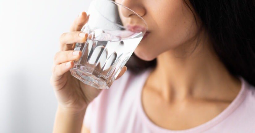woman drinks refreshing water from a glass 2026 09 24 13 08 38 utc