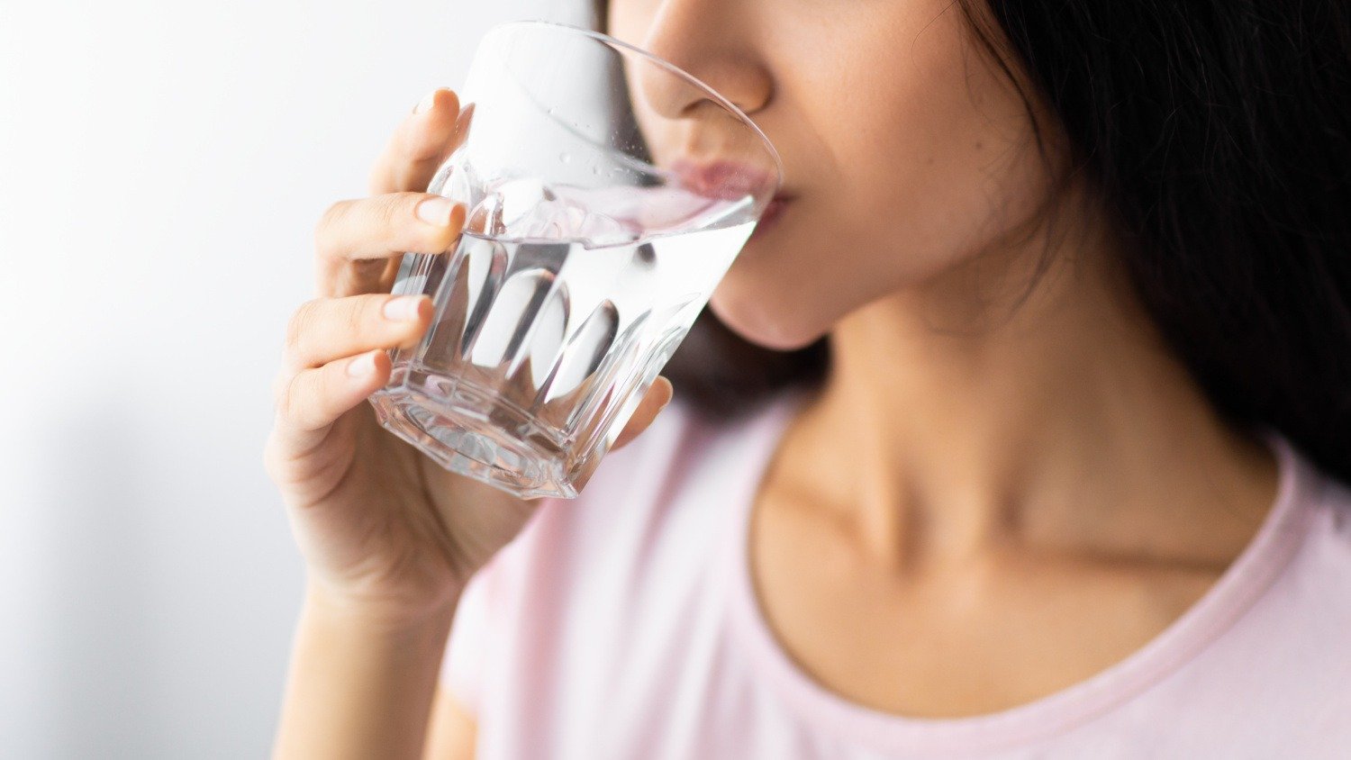 woman drinks refreshing water from a glass 2026 09 24 13 08 38 utc